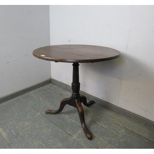 788 - A Georgian mahogany circular tilt-top supper table, on a plain column with splayed tripod supports.
... 