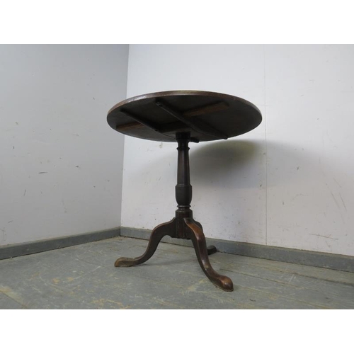 788 - A Georgian mahogany circular tilt-top supper table, on a plain column with splayed tripod supports.
... 