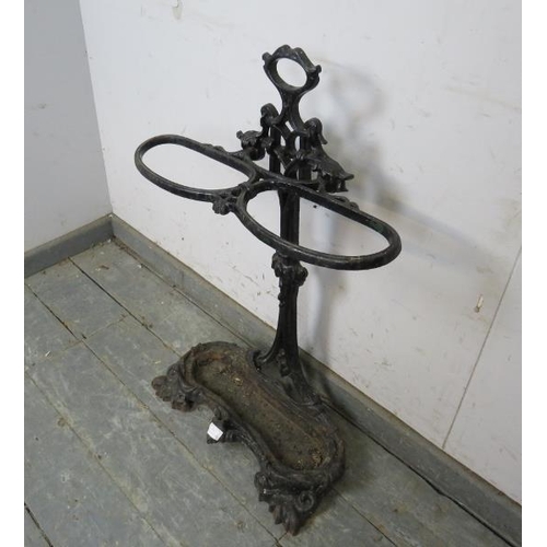 792 - A Victorian cast iron stick stand in the manner of Colebrookdale, painted black. 
H76cm W53cm D19cm ... 