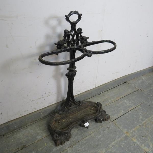 792 - A Victorian cast iron stick stand in the manner of Colebrookdale, painted black. 
H76cm W53cm D19cm ... 