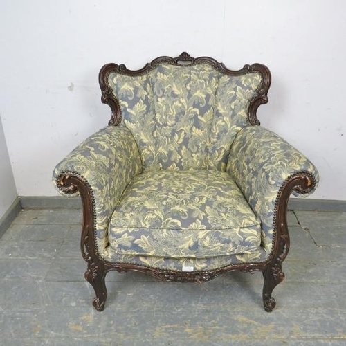 794 - A vintage French show-wood armchair, upholstered in blue and cream floral patterned material with br... 