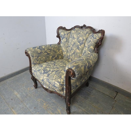 794 - A vintage French show-wood armchair, upholstered in blue and cream floral patterned material with br... 