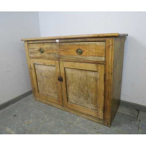 799 - An antique pine sideboard, housing two short drawers with pierced brass drop-ring handles, above cup... 