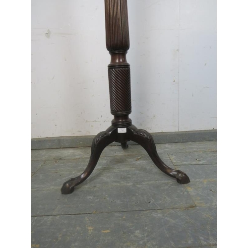 802 - A large Victorian mahogany torchiere/plant stand, the dished top above a reeded and spiral carved co... 