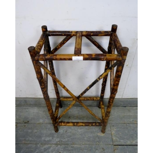 803 - A turn of the century colonial tiger bamboo stick stand, having two divided compartments. H71cm W36c... 