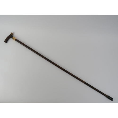 107 - A Victorian 15ct yellow gold mounted walking cane with tortoiseshell crutch handle. With a varnished... 