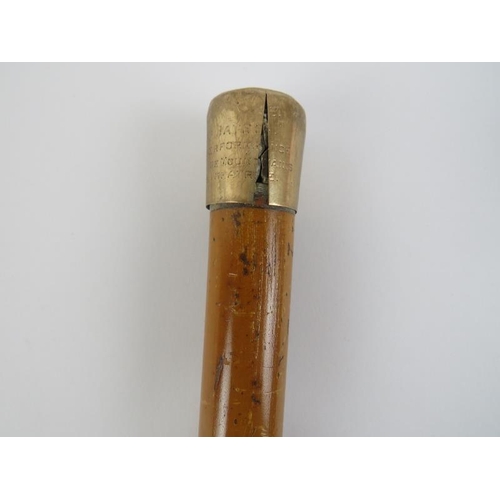 108 - A 9ct yellow gold mounted walking cane. With a lacquered wood shaft and horn ferrule, mark of M Jaco... 