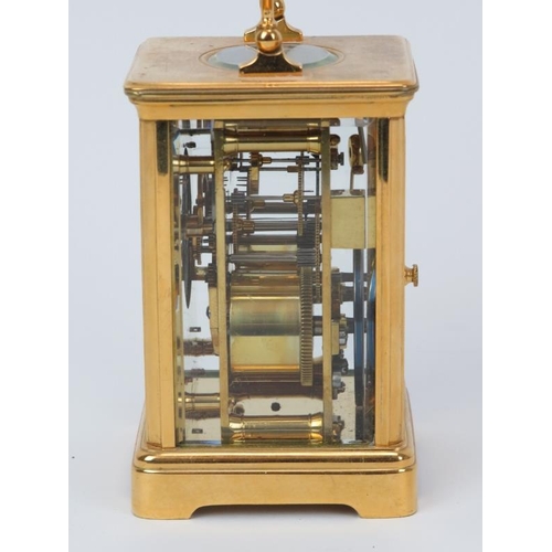 11 - A French gilt brass striking carriage clock, 20th century. With enamelled white dial and black Roman... 