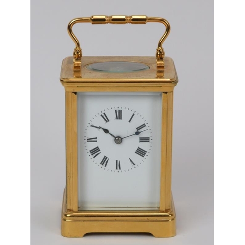 11 - A French gilt brass striking carriage clock, 20th century. With enamelled white dial and black Roman... 