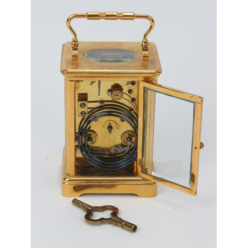 11 - A French gilt brass striking carriage clock, 20th century. With enamelled white dial and black Roman... 