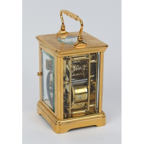 11 - A French gilt brass striking carriage clock, 20th century. With enamelled white dial and black Roman... 