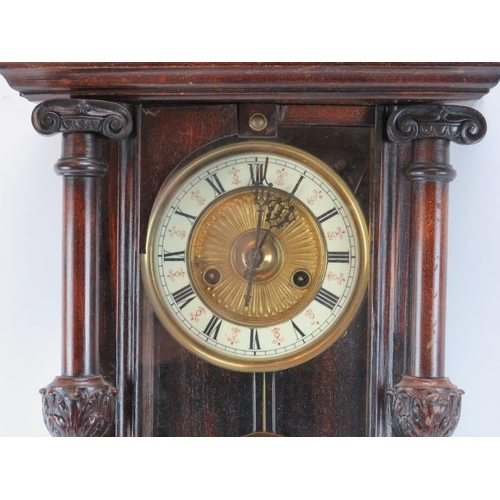 113 - A European wall clock, late 19th century. Probably German or Austrian. Key included. 64 cm height. 
... 