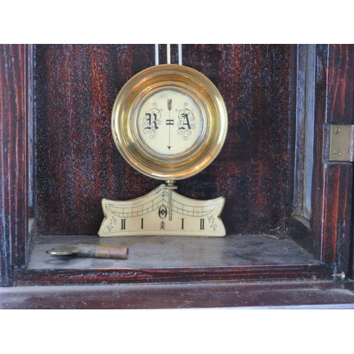 113 - A European wall clock, late 19th century. Probably German or Austrian. Key included. 64 cm height. 
... 