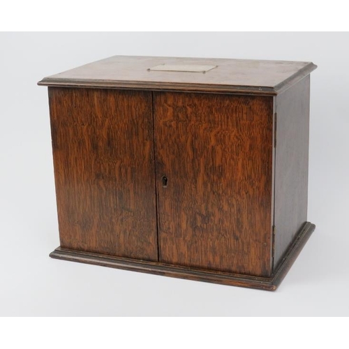 12 - An antique oak combined humidor and decanter box. With plated silver plaque to the top inscribed ‘Ju... 