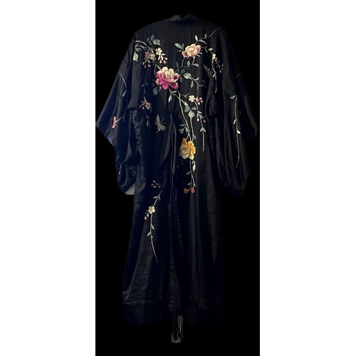 140 - A Chinese silk embroidered black robe, circa 1920s/30s. 137 cm length.
Condition report: Some age re... 