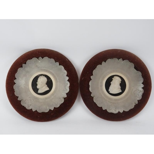 143 - A pair of carved alabaster circular plaques, possibly Italian, Grand Tour, 19th century. Displayed i... 