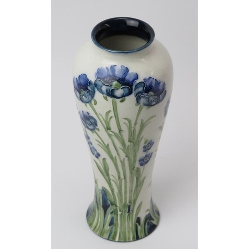 15 - A William Moorcroft James Macintyre & Co Florian Ware blue poppy decorated vase. Signed W Moorcroft ... 