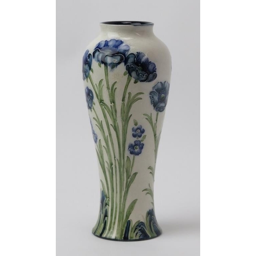 15 - A William Moorcroft James Macintyre & Co Florian Ware blue poppy decorated vase. Signed W Moorcroft ... 