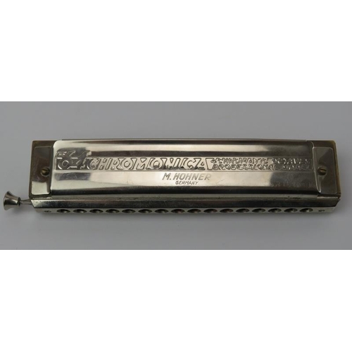 16 - A Hohner 64 Chromonica professional model harmonica. With original case.
Condition report: Some age ... 