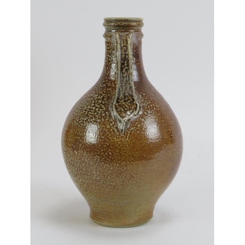 168 - A German salt glazed stoneware Bellarmine flask jug, probably 18th century. 18.7 cm height.
Conditio... 