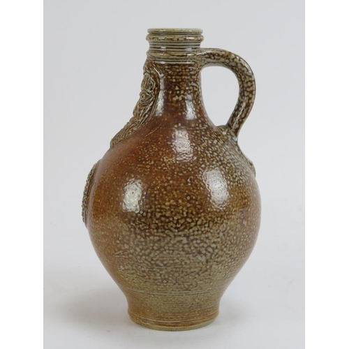 168 - A German salt glazed stoneware Bellarmine flask jug, probably 18th century. 18.7 cm height.
Conditio... 