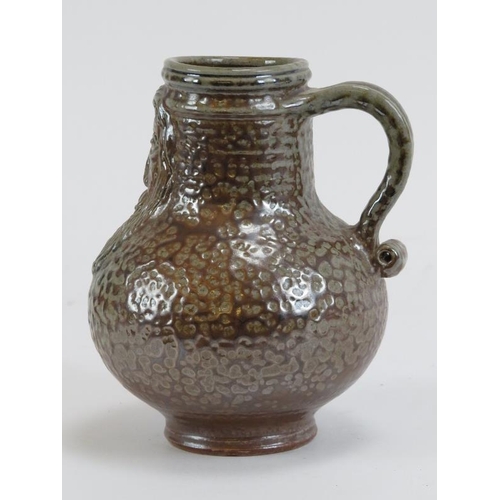 169 - A German tiger glazed stoneware Bellarmine jug. 13.8 cm height.
Condition report: Good condition.