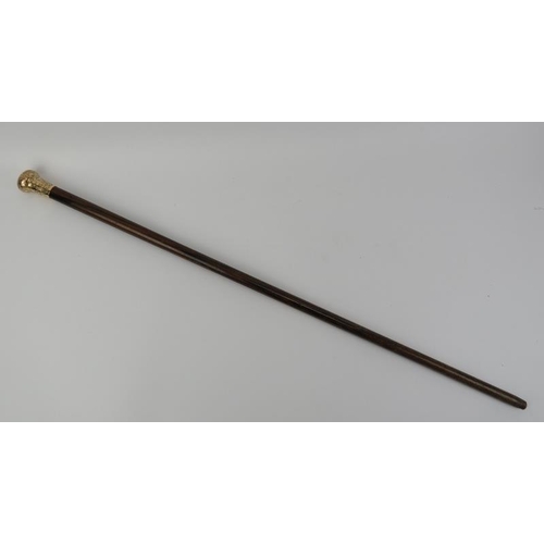 17 - A gold plated metal mounted rosewood walking cane. The handle with bright cut scrolling foliate deco... 