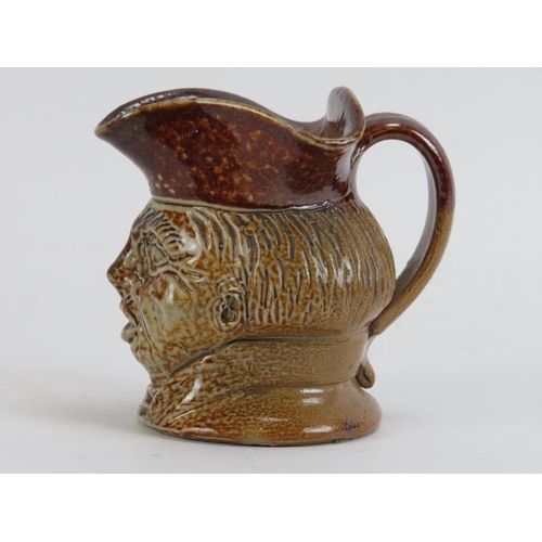 171 - A tiger glazed stoneware character jug, 18th/19th century. Depicting a male head with tricorn hat. 1... 