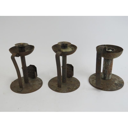 185 - Three Viennese Arts and Crafts secessionist iron chamber sticks, early 20th century. Incorporated wi... 