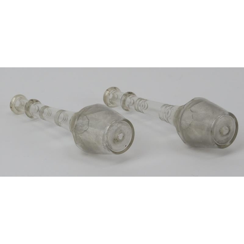 20 - Two late Georgian / Regency period clear glass toddy lifters. With knopped stems and faceted decorat... 