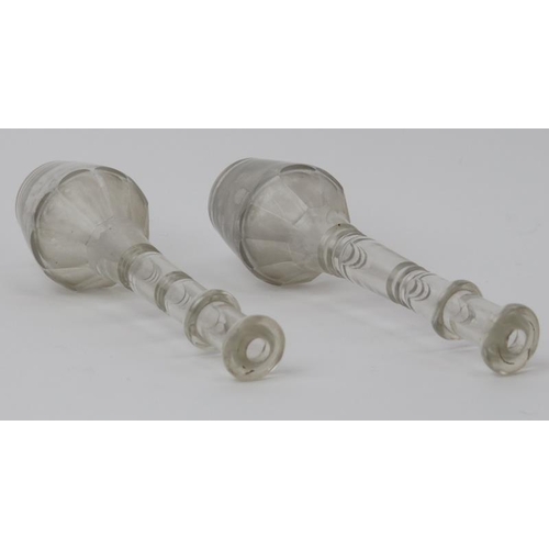 20 - Two late Georgian / Regency period clear glass toddy lifters. With knopped stems and faceted decorat... 