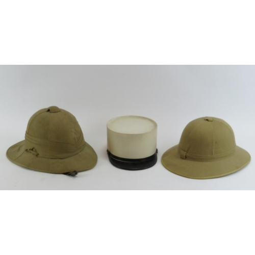 261 - Two vintage British pith helmets and a French Foreign Legion kepi. (3).
Condition report: Some age r... 