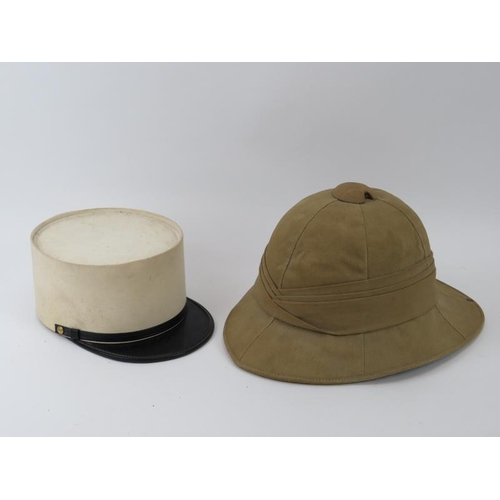 261 - Two vintage British pith helmets and a French Foreign Legion kepi. (3).
Condition report: Some age r... 