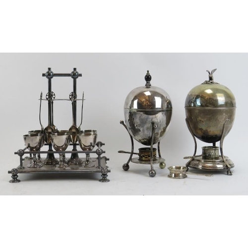 267 - A group of silver plated items. Two egg warmers and cruet included. 23.5 cm tallest height.
Conditin... 