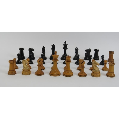 27 - A turned boxwood and ebony chess set, late 19th/early 20th century. Housed in an mahogany box. Addit... 