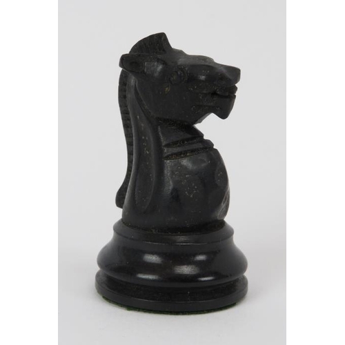 27 - A turned boxwood and ebony chess set, late 19th/early 20th century. Housed in an mahogany box. Addit... 