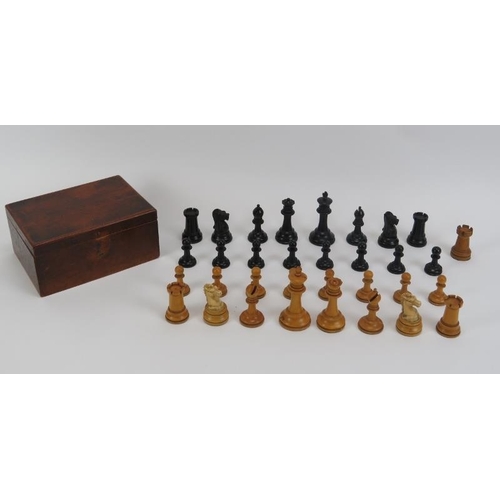 27 - A turned boxwood and ebony chess set, late 19th/early 20th century. Housed in an mahogany box. Addit... 