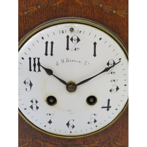 276 - An inlaid oak Edwardian mantel clock by J.W. Benson with striking movement. Pendulum included, no ke... 