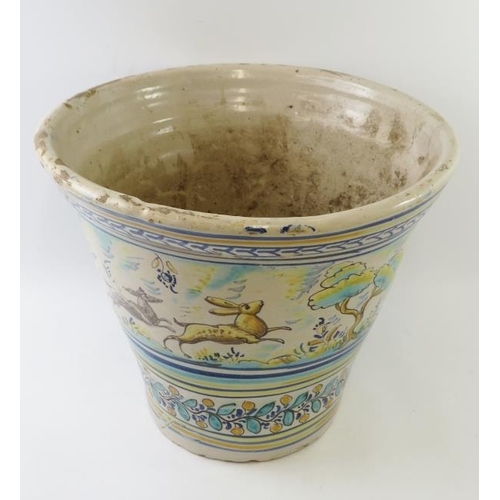 277 - A large decorative Spanish hand decorated Triana style pot with hare and hunter decoration. Height 3... 