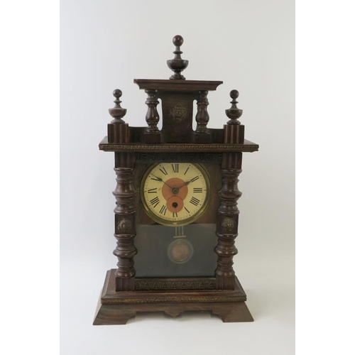 293 - A turn of the century continental mantel clock with carved wood case and a late 20th century Georgia... 