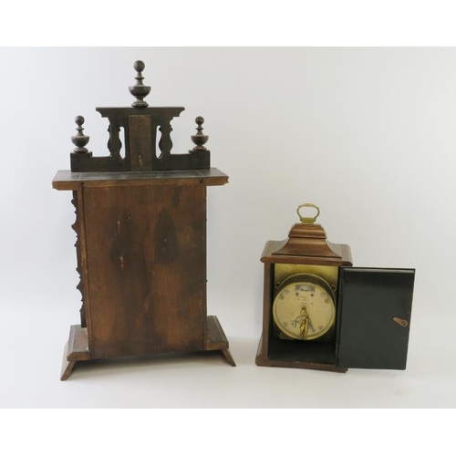 293 - A turn of the century continental mantel clock with carved wood case and a late 20th century Georgia... 