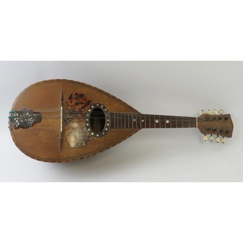 295 - A vintage Neopolitan mandolin with strung inlay to bulb back and tortoiseshell and mother of pearl i... 