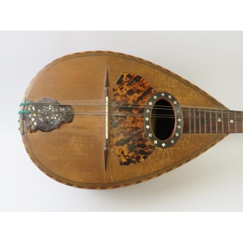 295 - A vintage Neopolitan mandolin with strung inlay to bulb back and tortoiseshell and mother of pearl i... 