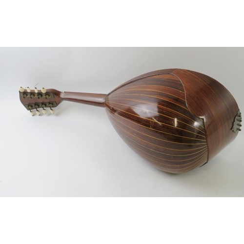 295 - A vintage Neopolitan mandolin with strung inlay to bulb back and tortoiseshell and mother of pearl i... 