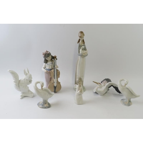 298 - Seven mixed Lladro, Nao and Kaiser porcelain figures including a squirrel, stork, geese, angel, cell... 