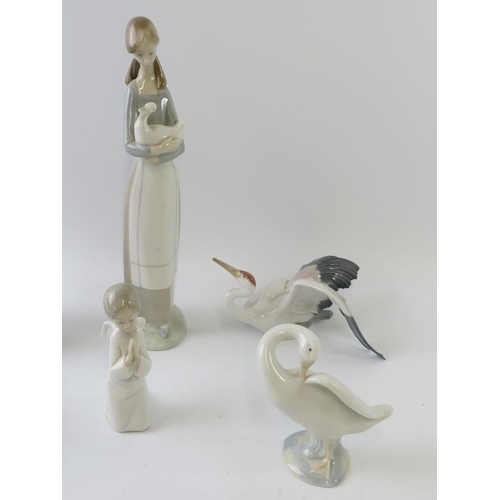 298 - Seven mixed Lladro, Nao and Kaiser porcelain figures including a squirrel, stork, geese, angel, cell... 