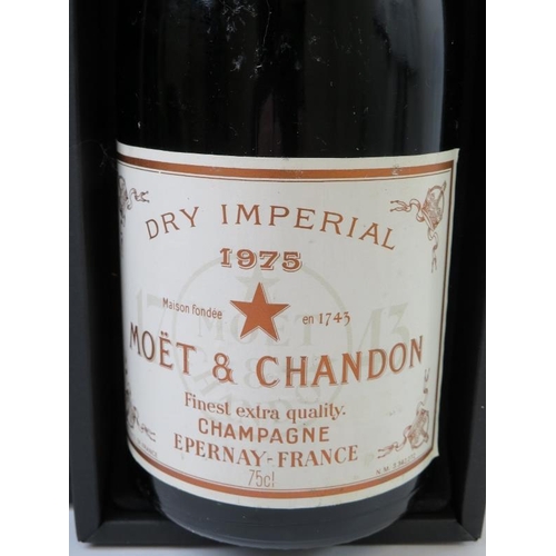 322 - A bottle of Moet et Chandon Dry Imperial 1975 vintage champagne in box. 75cl