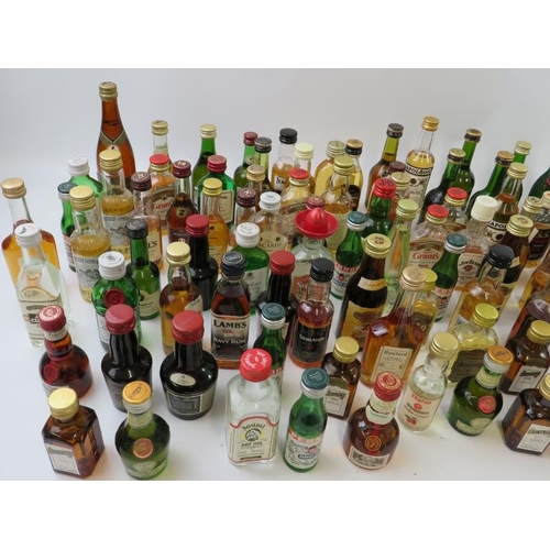 350 - A mixed lot of over 80 miniature whiskies, cognacs, spirits and liqueurs including many well known n... 