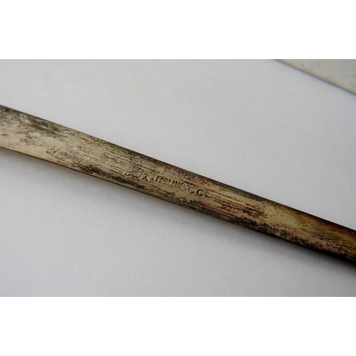 386 - A 20th century Chinese white metal tongue scraper style book mark with Chinese character decoration.... 