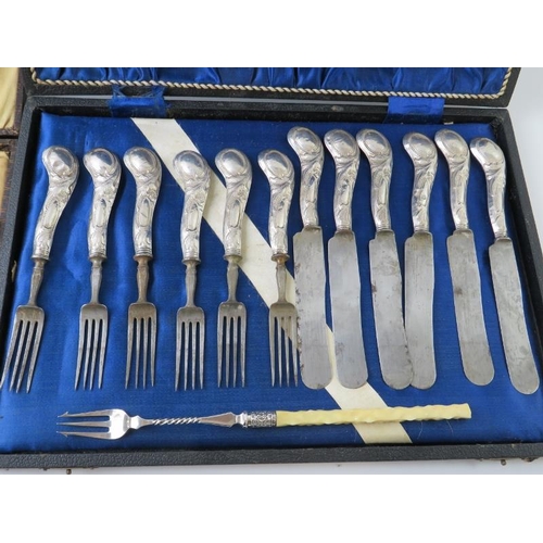 387 - A set of twelve 19th century continental white metal handled dessert knives and forks, a silver blad... 